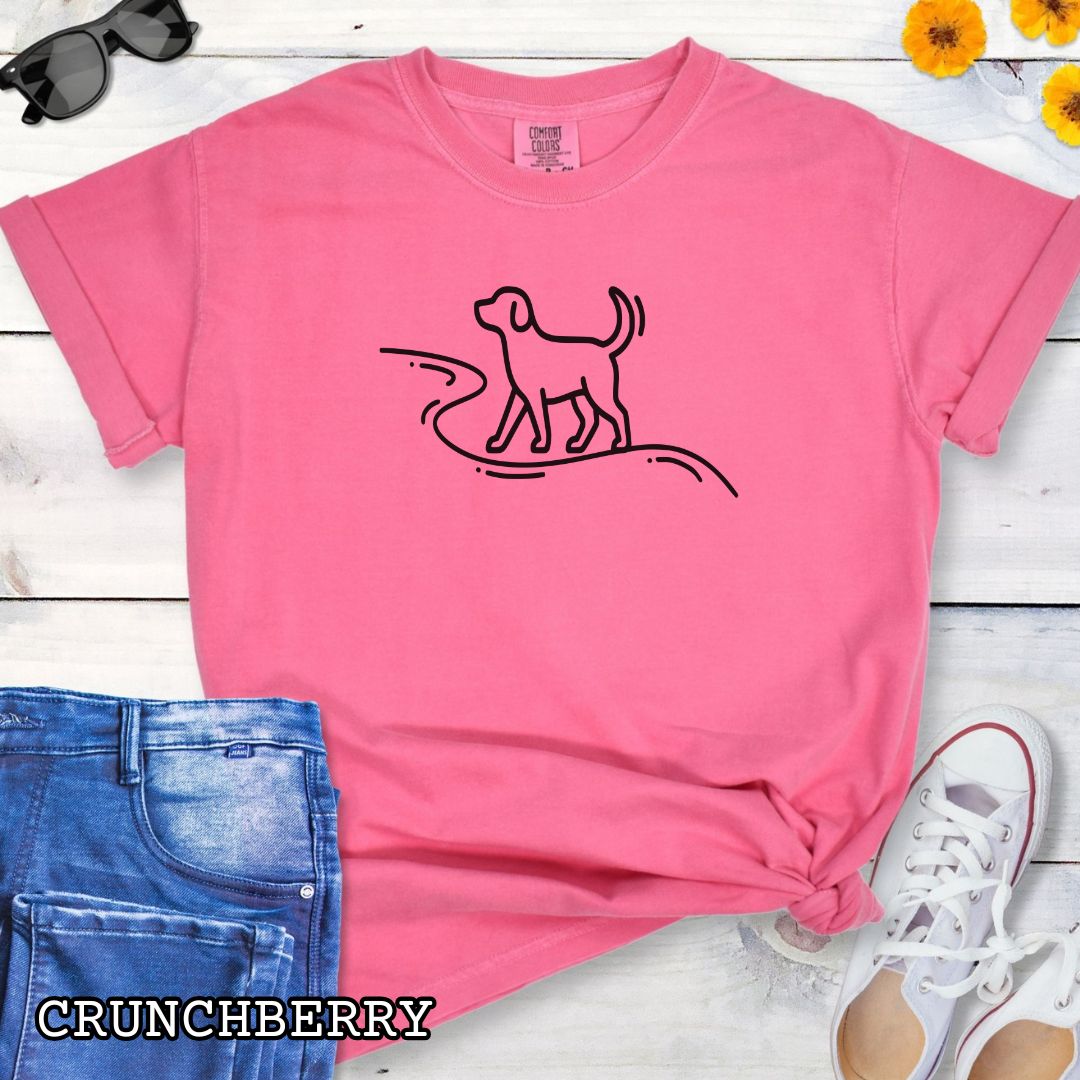 Pink Comfort Colors t-shirt featuring minimalist dog walking line art, perfect for dog hikers, outdoor dog lovers, and hiking with dogs enthusiasts.
